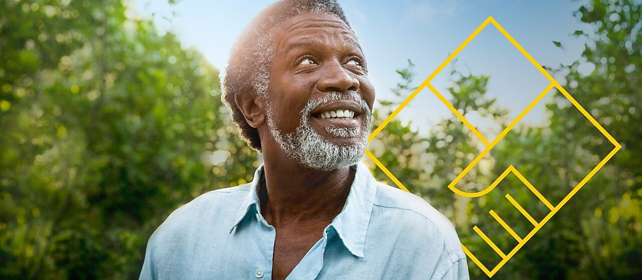Smiling man with a beard in front of trees with an outline of the Generating shareholder value graph