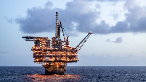 Offshore oil platform in the see lit up at night