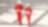 Male and female worker in red overalls and white helmets and hearing protection walking