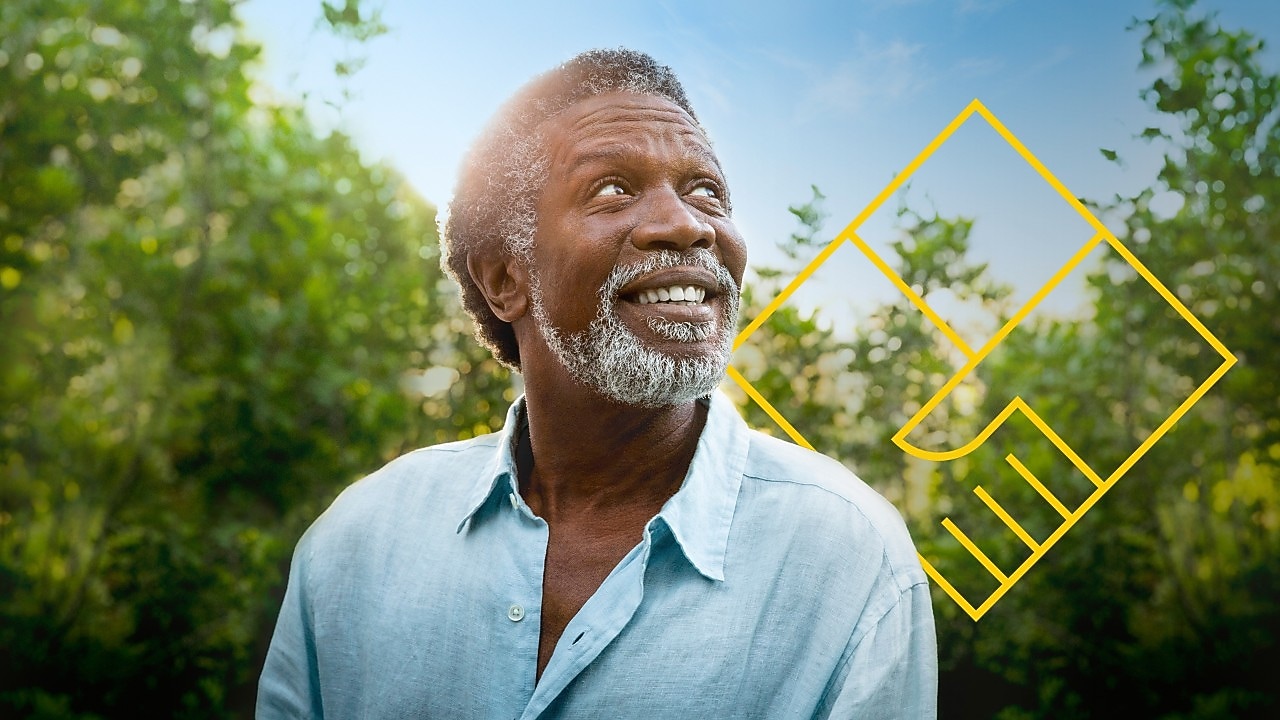 Smiling man with a beard in front of trees with an outline of the Generating shareholder value graph
