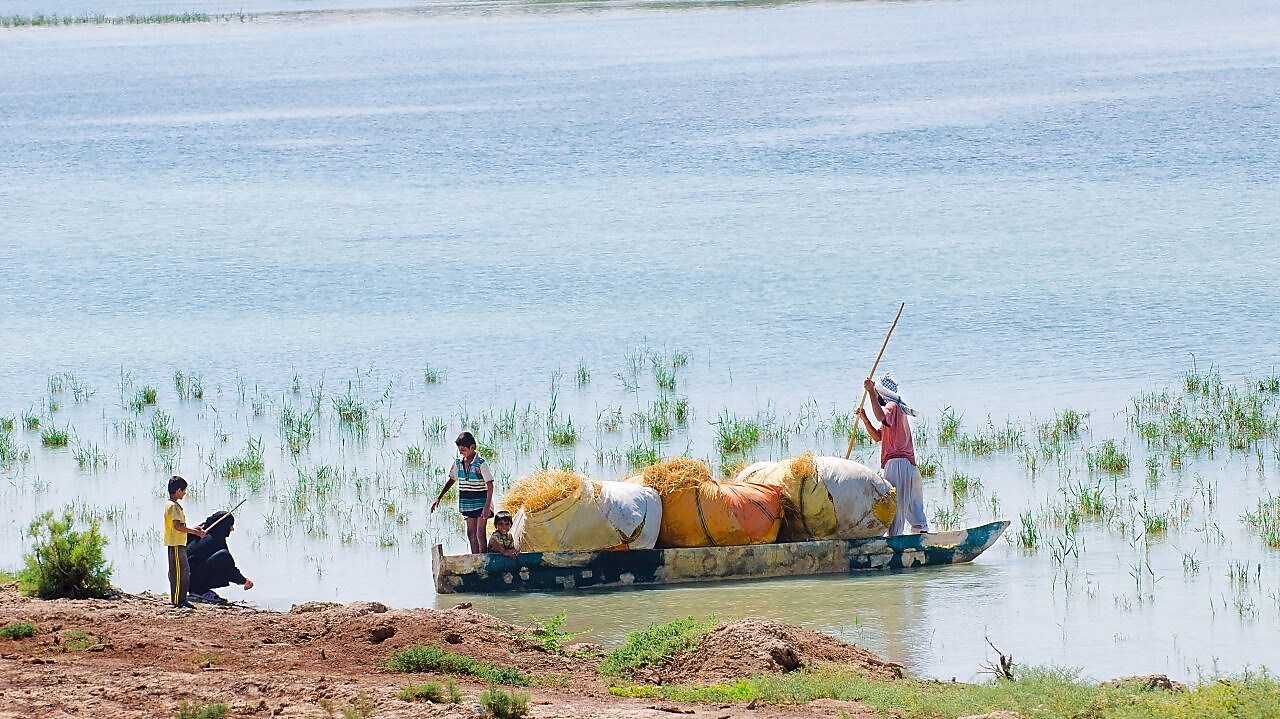 Local people on the Yabani Canal in the South of Iraq