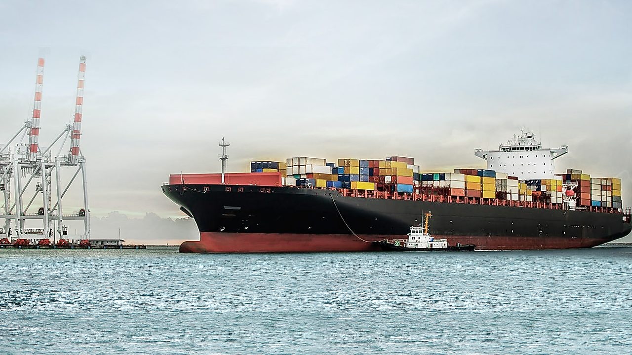 large tanker at sea loaded with container crates