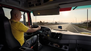 truck driver driving on empty road