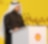 Mohammed Al Athaba stands at a podium giving a speech