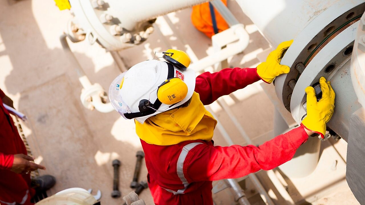 Worker wearing safety mask and gloves
