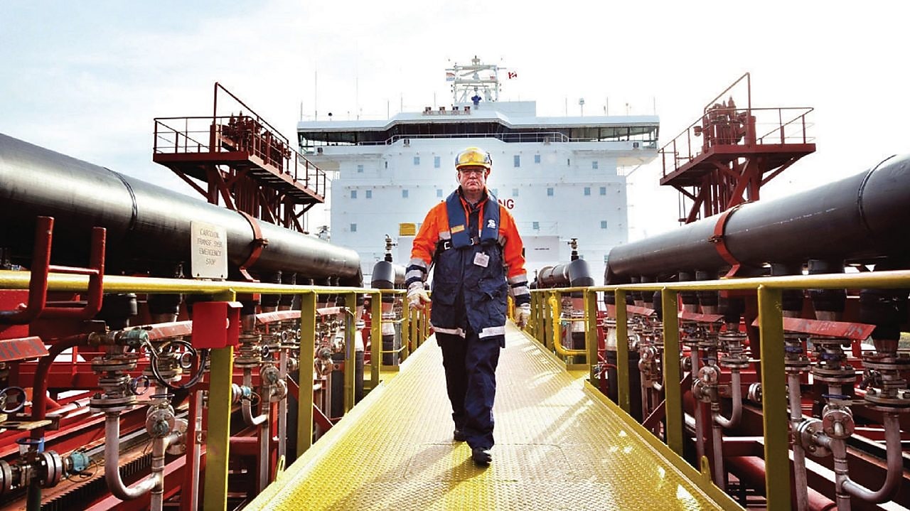 worker walking around a Shell vessel