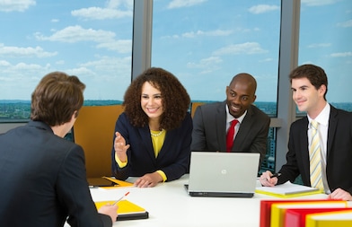 four shell employees in a meeting 