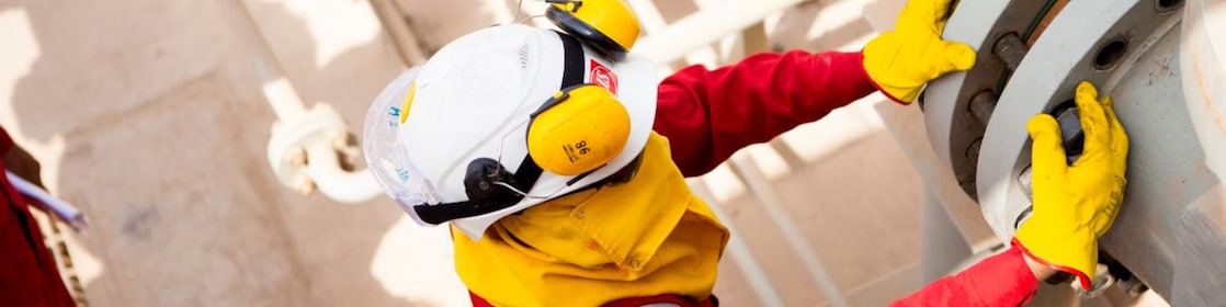 Worker wearing safety mask and gloves