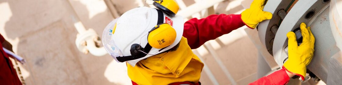 Worker wearing safety mask and gloves