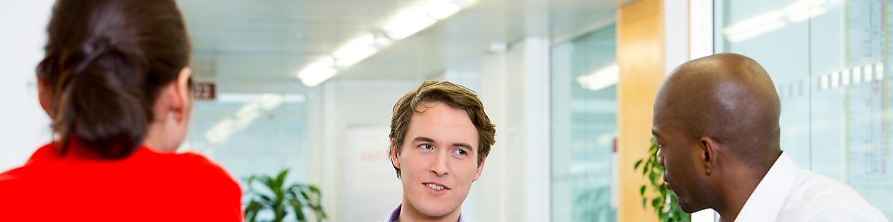 two employees interviewing a potential candidate