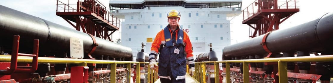 worker walking around a Shell vessel