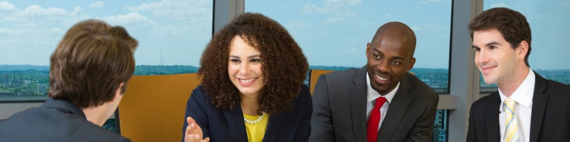 four shell employees in a meeting 