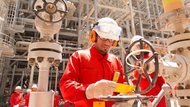 worker checking a valve