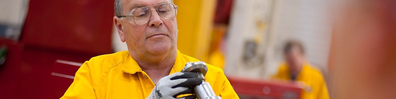 Worker inspecting a piece of equipment