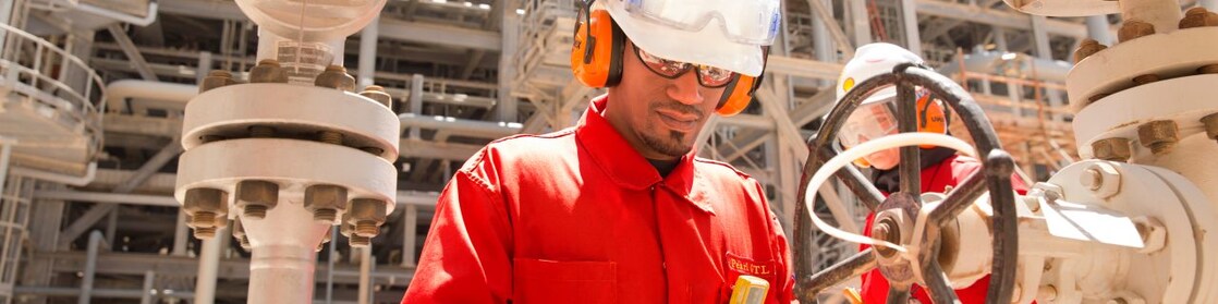 worker checking a valve