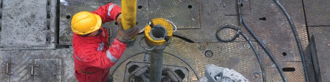 Man drilling in a rig