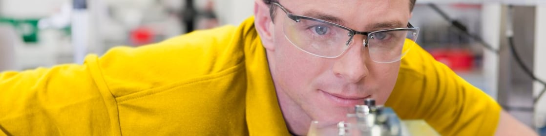 Collection of images showing employees and graduates at work