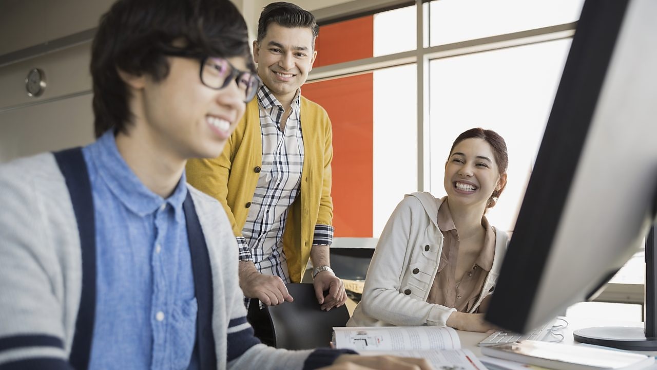 Students and teacher in computer lab