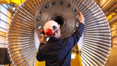 Engineer Inspecting Turbine