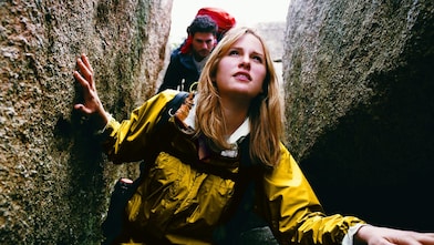 Two People Orienteering Between Rocks