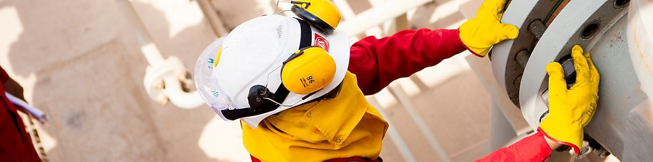 Worker wearing safety mask and gloves