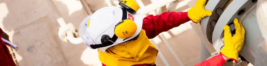 Worker wearing safety mask and gloves