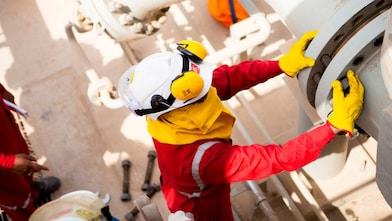 Worker wearing safety mask and gloves