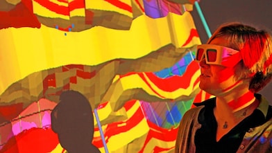 lady wtaching screen with 3d glasses