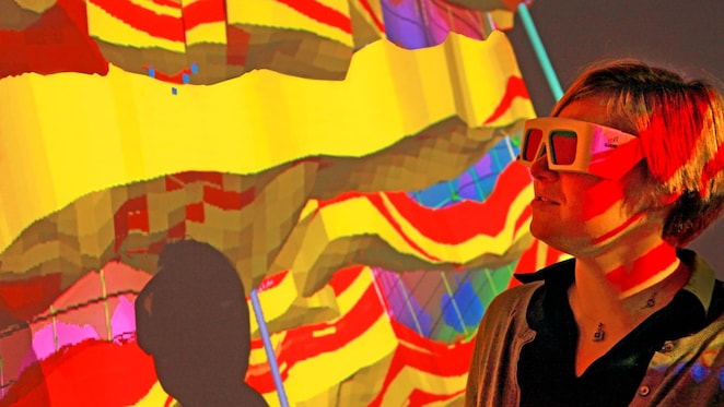 lady wtaching screen with 3d glasses