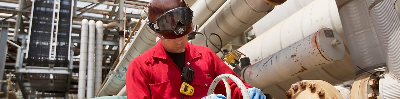 An engineer checks platform equipment for safety