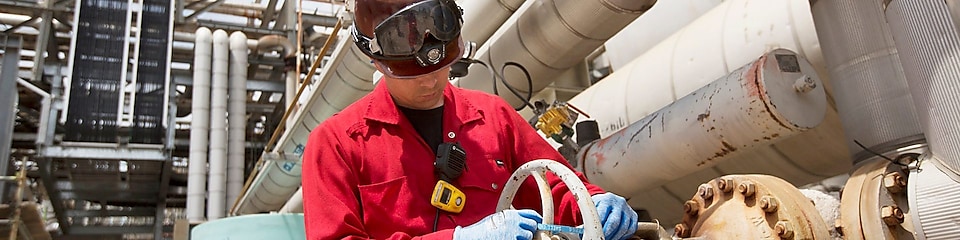 An engineer checks platform equipment for safety