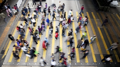 People crossing a busy street in Hong Kong