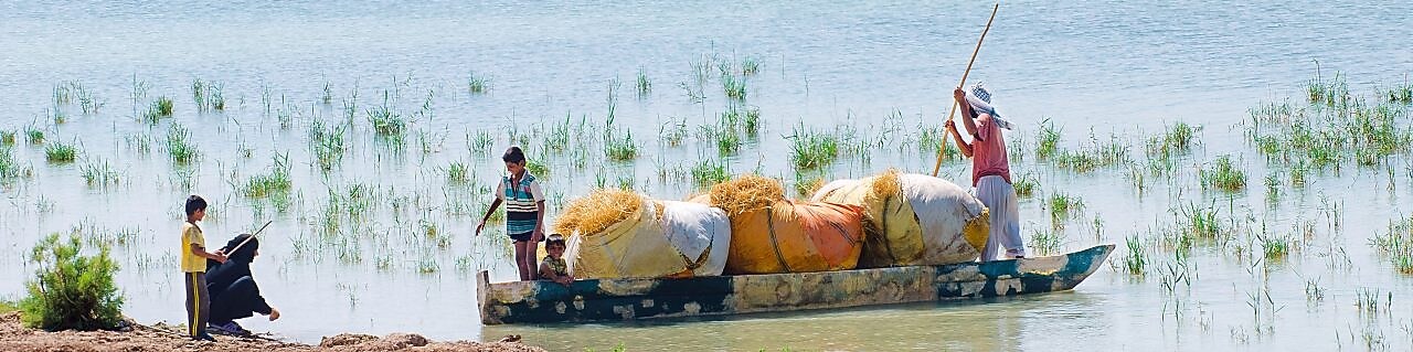 Local people on the Yabani Canal in the South of Iraq